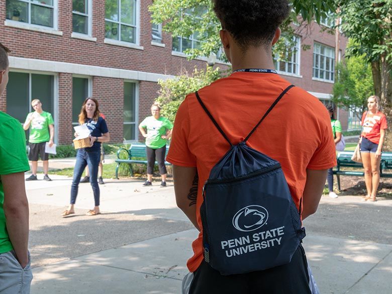 Student wearing a Penn State backpack