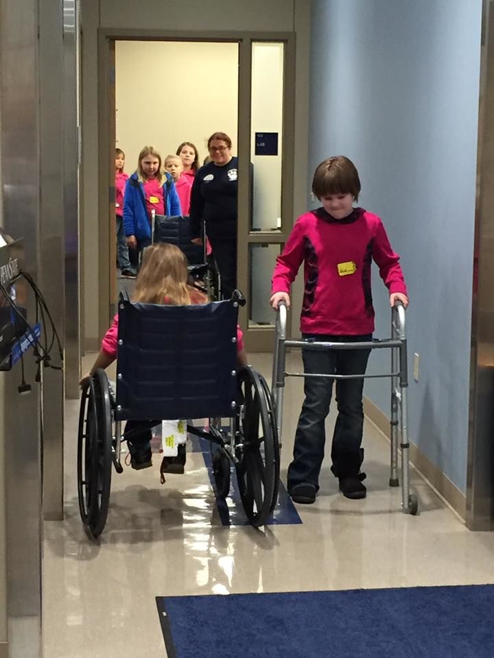Girl Scout Brownies learn how it would feel to be in a wheelchair or have to use a walker 