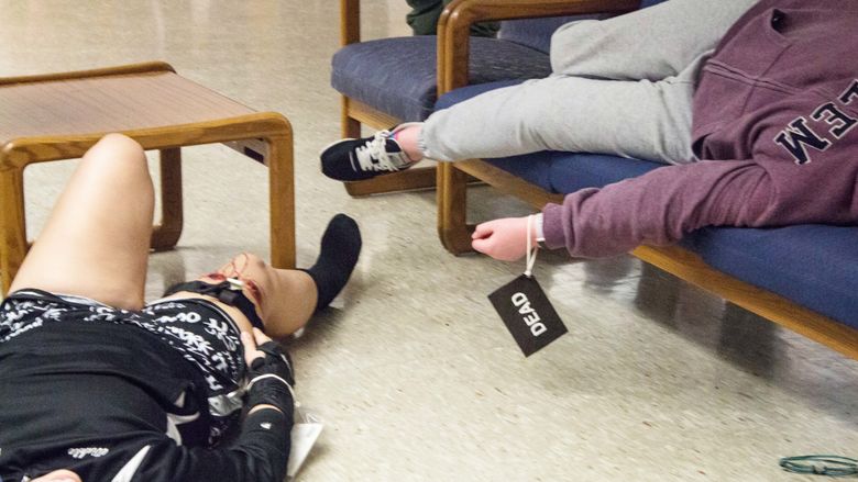 Students play dead during an active shooter training at Penn State Beaver.