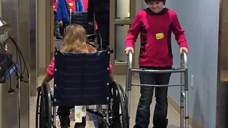 Girl Scout Brownies learn how it would feel to be in a wheelchair or have to use a walker 