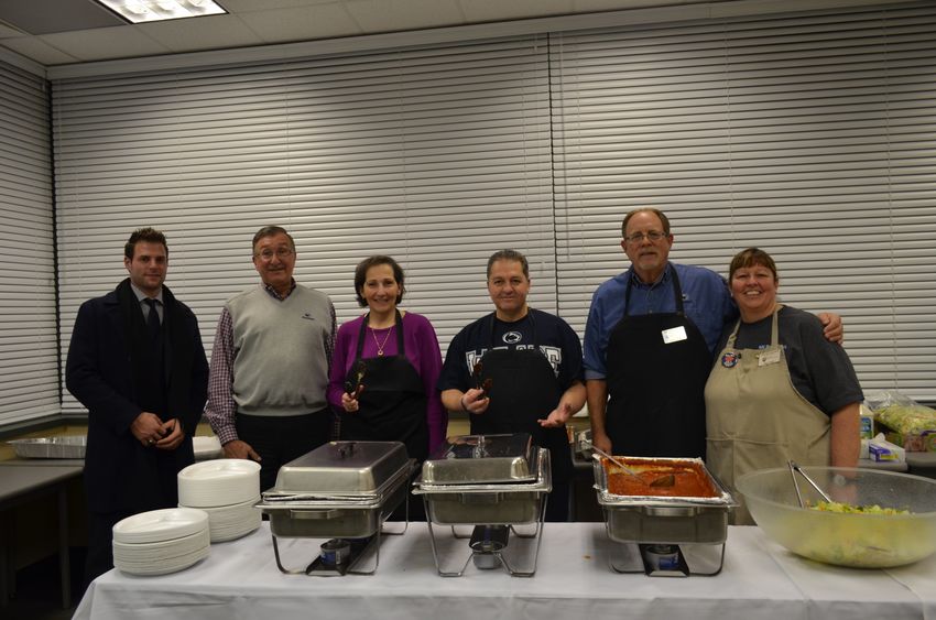 Campus Director Dr. Carrick and alumni and advisory board members help serve spaghetti at 2014 fundraiser