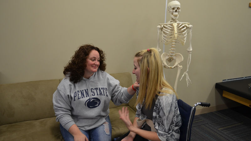 OTA student practices on another student during a class