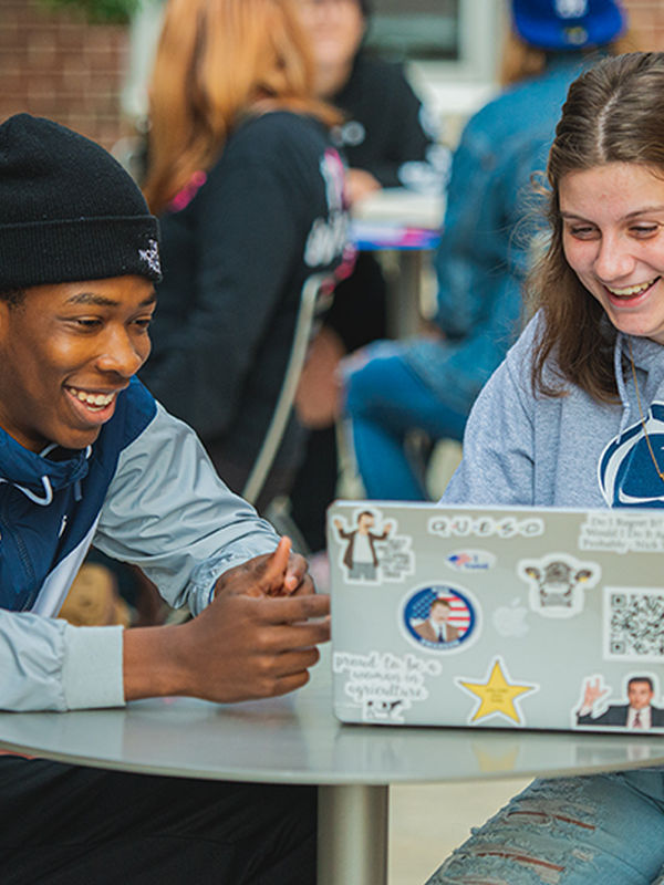 Two students studying outside