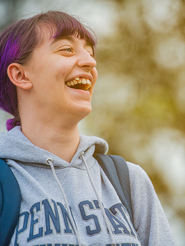 Student laughing outside
