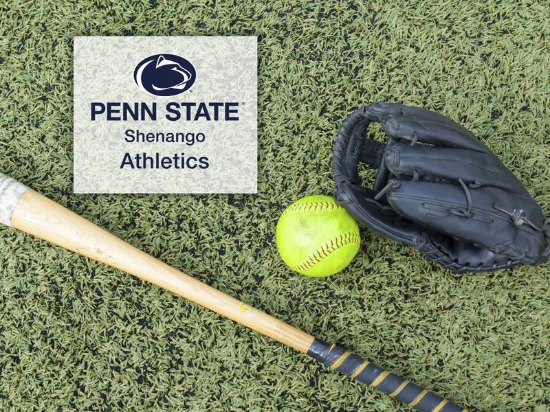 Green softball laying on a turf field next to a black glove and bat with the Penn State Shenango Athletics logo overlayed on a white background