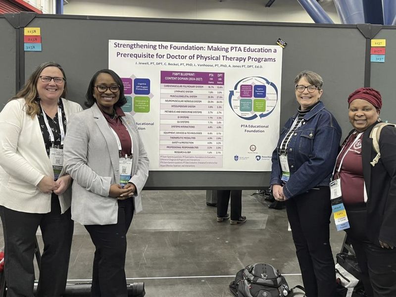 Jennifer Jewell, Ashanti Jones, Carol Beckel and Lisa Vanhoose pose with poster presentation