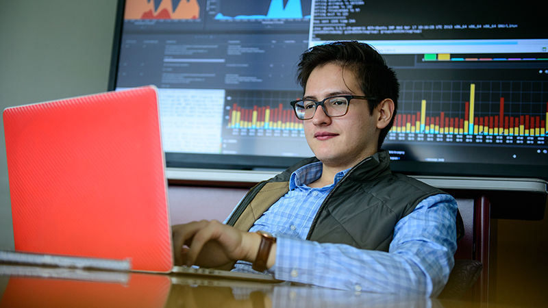 Student working on computer. 