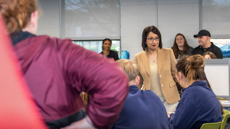 Neeli Bendapudi talking with room of students