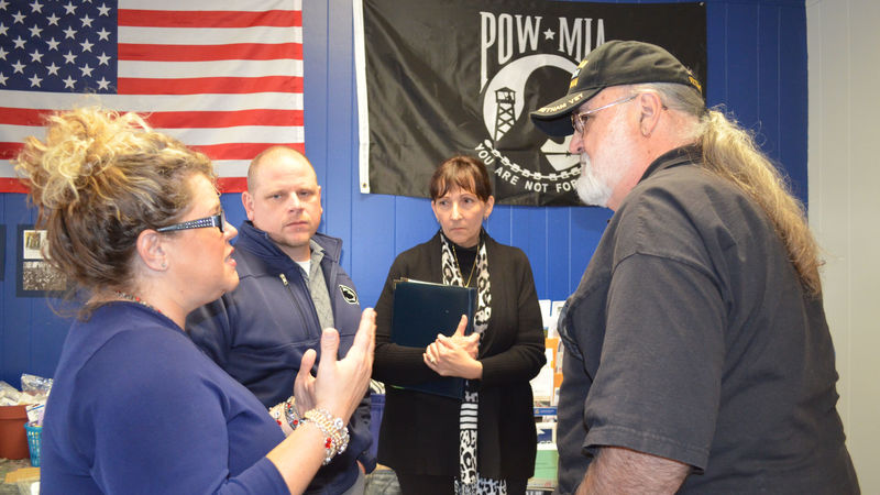 Guests talking during the campus' Veterans Center celebration on October 25.