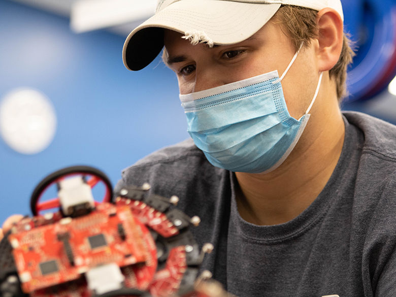 Engineering student working on robot