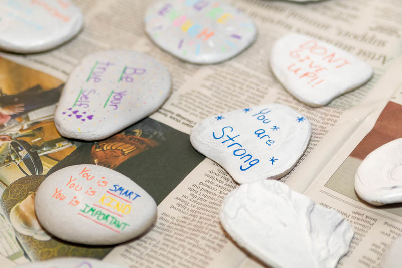 Rocks with various affirmations painted on. 