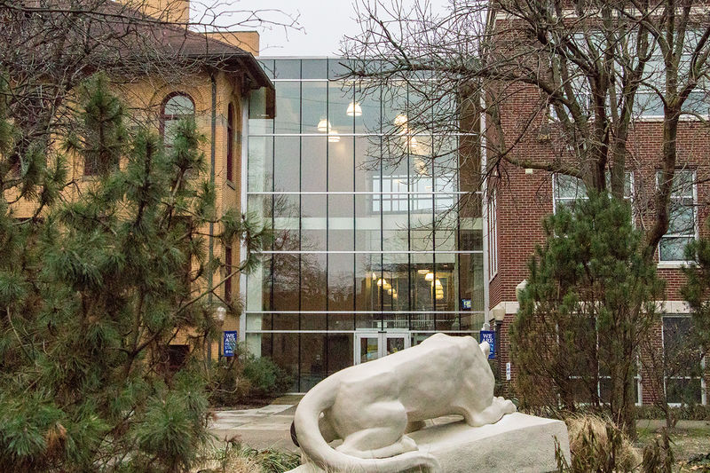The Lion Shrine overlooks the atrium between Lecture Hall and Sharon Hall on a fall day