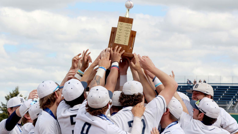 The Penn State DuBois baseball team lifts the PSUAC championship trophy as a team after winning the championship on Monday