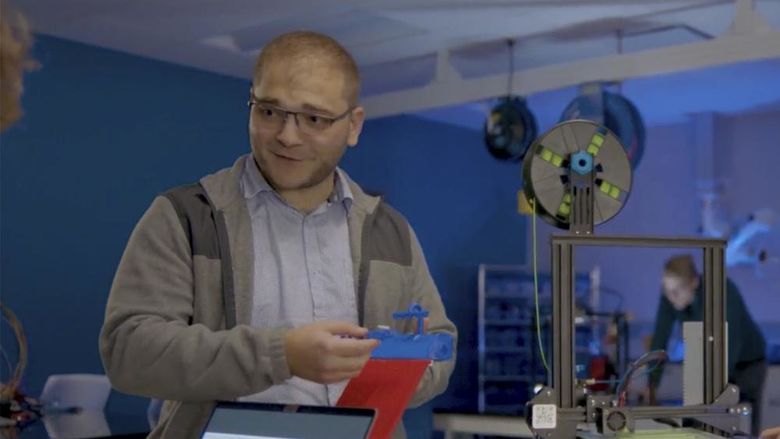 Matthew Caputo demonstrating how a 3D printer works