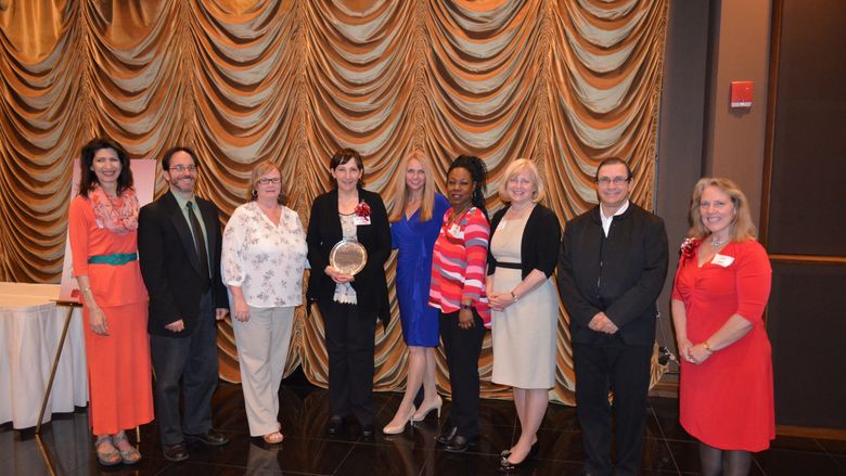 Shenango faculty and staff pose with CCC's Fern Torok (far right) at this year's annual dinner.