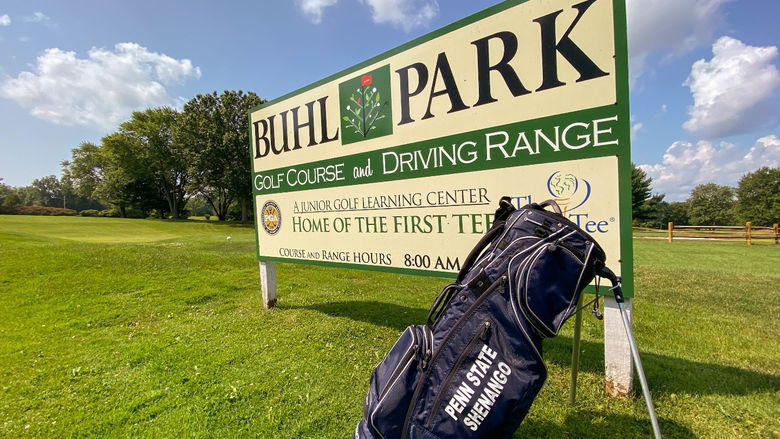 Penn State Shenango golf bag in front of Buhl Park Golf Course sign