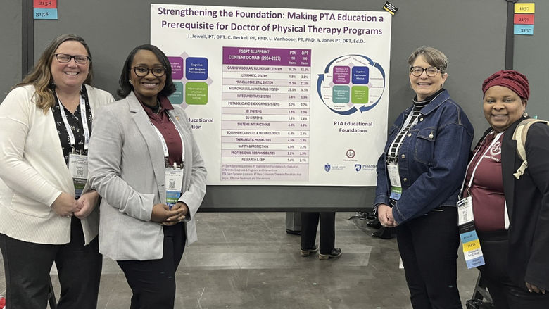 Jennifer Jewell, Ashanti Jones, Carol Beckel and Lisa Vanhoose pose with poster presentation