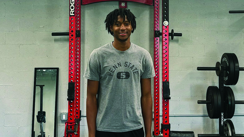 Malik Davis standing in a weight room