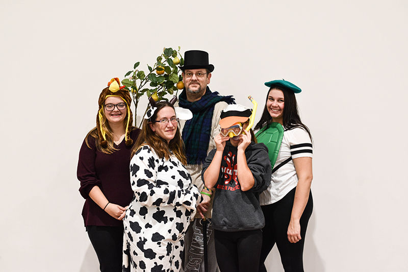 Several people from the cast of A Christmas Pudding standing on stage at Shenango campus.