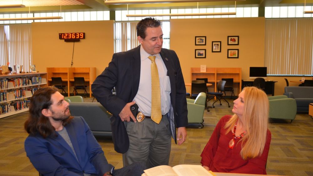 Shenango campus faculty talking with Daniel Pustinger from the PA Board of Probation and Parole at a recent workshop