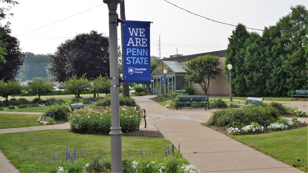 A Penn State Shenango banner on the campus's Pedestrian Mall area