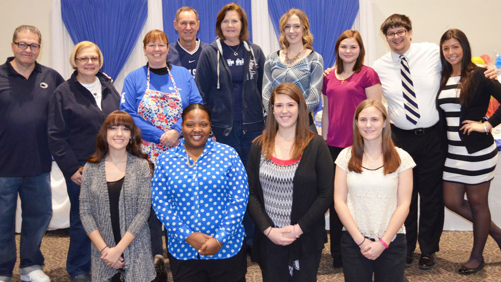 Students and Shenango Alumni Society members gather before the 2016 THON Spaghetti Dinner fundraiser A group of people stand and kneel for a picture in the campus' auditorium before the 2016 Spaghetti Dinner