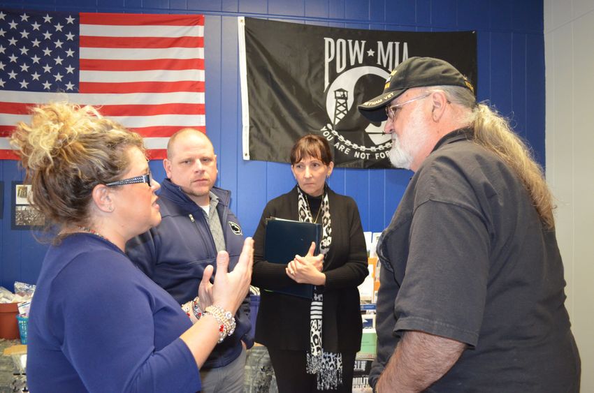 Student Wendy Caszatt speaks to staff and guests during the Veterans Center grand opening celebration.