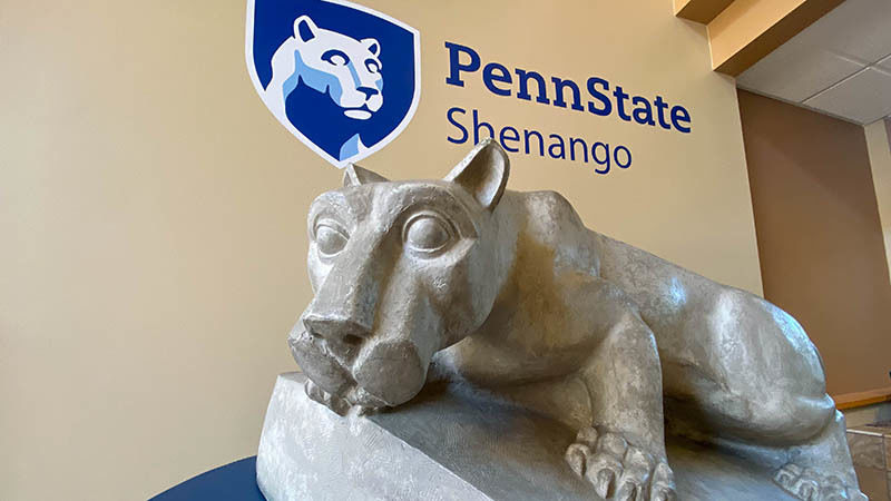 Lion Shrine statue under Penn State Shenango mark